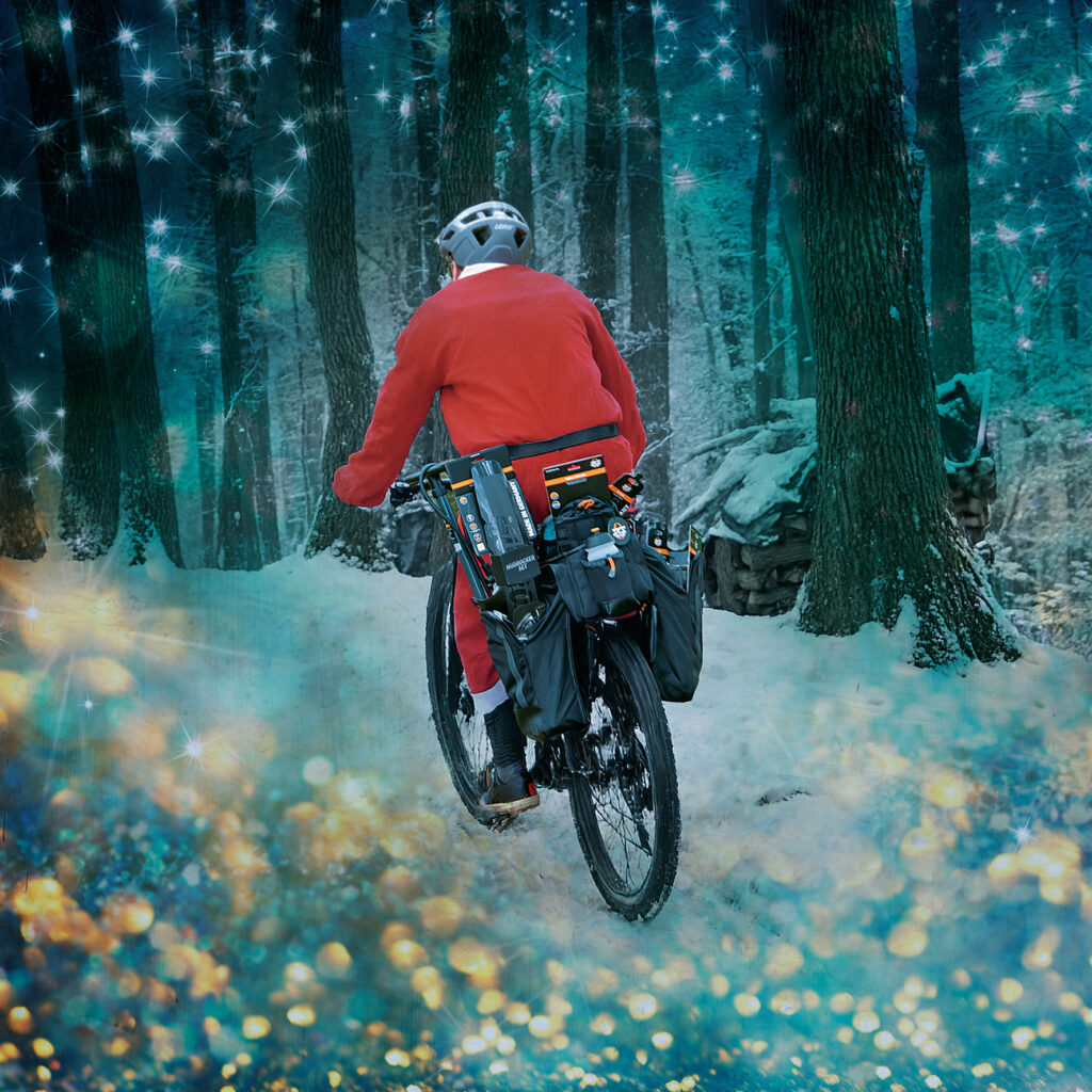 Santa Claus with sks pannier drives through the winter forest